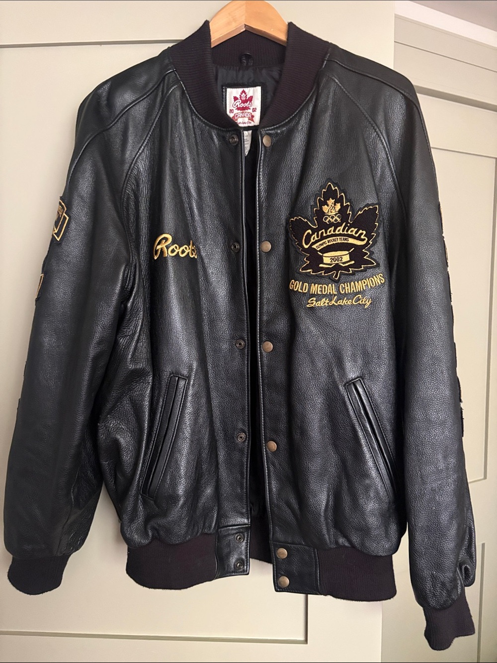 Roots Black Leather Bomber Jacket with Gold Embroidery